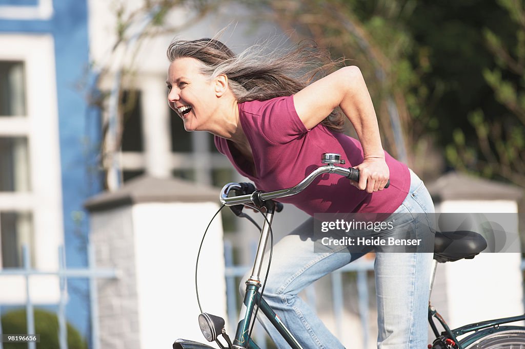 An older woman cycling