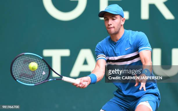 Borna Coric from Croatia returns the ball to Roberto Bautista Agut from Spain during their match at the ATP tennis tournament in Halle, western...