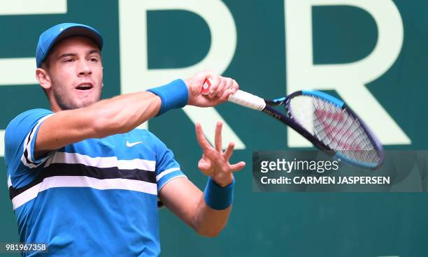 Borna Coric from Croatia returns the ball to Roberto Bautista Agut from Spain during their match at the ATP tennis tournament in Halle, western...