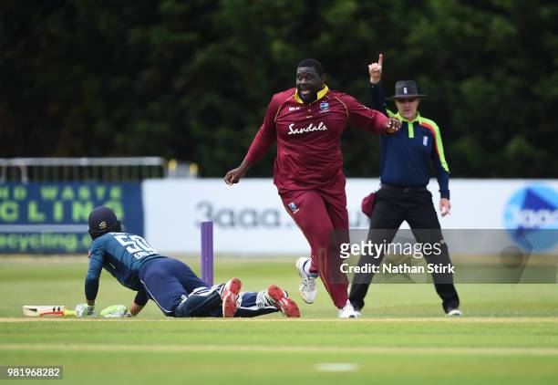 Rahkeem Cornwall of West Indies celebrates as Ben Foakes of England is run out during the Tri-Series International match between England Lions and...