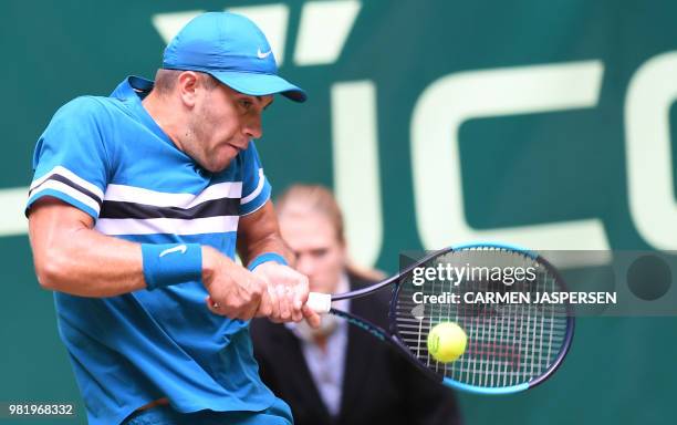 Borna Coric from Croatia returns the ball to Roberto Bautista Agut from Spain during their match at the ATP tennis tournament in Halle, western...