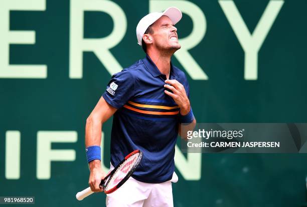 Roberto Bautista Agut from Spain reacts during his match against Borna Coric from Croatia at the ATP tennis tournament in Halle, western Germany, on...