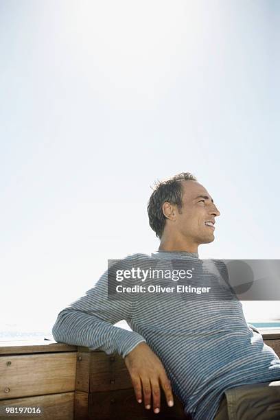man sitting outside - oliver eltinger stock pictures, royalty-free photos & images
