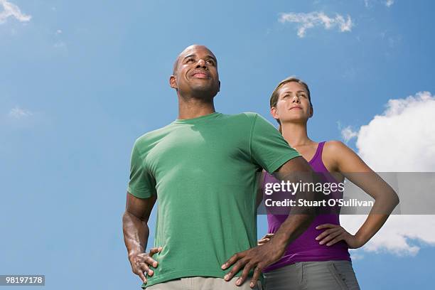 man and woman standing against sky - man hand on hip stock pictures, royalty-free photos & images