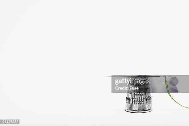 needle and thimble - thimble stock pictures, royalty-free photos & images