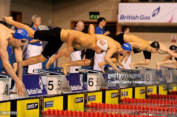 Ross Davenport of Loughborough University dives in for the start of the final of the Mens Open 100m Freestyle during the British Gas Swimming...