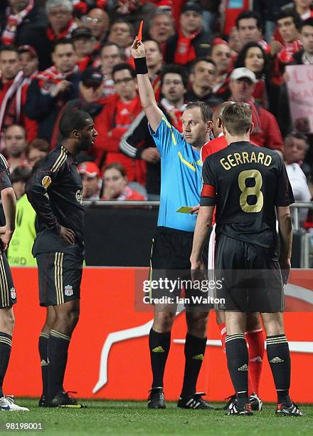 Ryan Babel of Liverpool is shown a red card and sent off by referee Jonas Eriksson during the UEFA Europa League, first leg match between Benfica and...