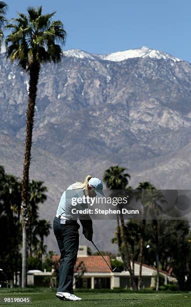 Suzann Pettersen of Norway hits her tee shot on the fifth hole during the first round of the Kraft Nabisco Championship at Mission Hills Country Club...
