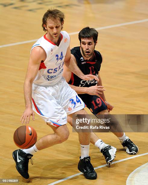 Zoran Planinic of CSKA Moscow competes with Fernando San Emeterio of Caja Laboral during the Euroleague Basketball 2009-2010 Play Off Game 4 between...