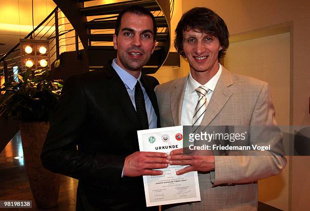 Markus Babbel and Ralf Santelli pose after receive the DFB Football Trainer Certificate at the Inter Conti hotel on April 1, 2010 in Cologne, Germany.