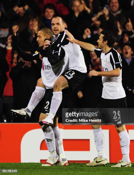 Bobby Zamora of Fulham celebrates with Danny Murphy and Simon Davies as he scores their first goal during the UEFA Europa League quarter final first...