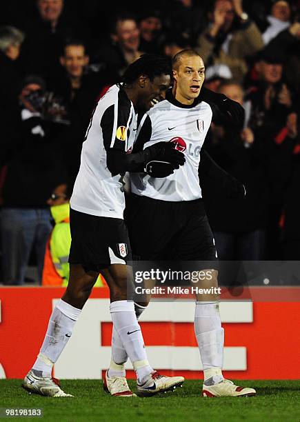 Bobby Zamora of Fulham celebrates with Dickson Etuhu as he scores their first goal during the UEFA Europa League quarter final first leg match...