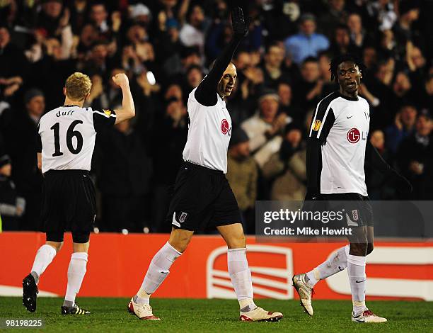 Bobby Zamora of Fulham celebrates with Damien Duff and Dickson Etuhu as he scores their first goal during the UEFA Europa League quarter final first...