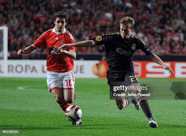 Lucas Levia of Liverpool competes for the ball with Pablo Aimar of Benfica during the UEFA Europa League quarter final first leg match between...