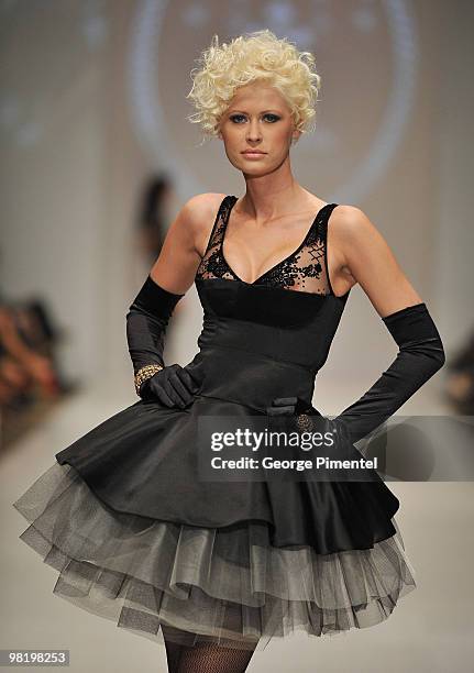 Model walks the runway wearing Coccolily fall 2010 collection at the Allstream Centre on April 1, 2010 in Toronto, Canada.