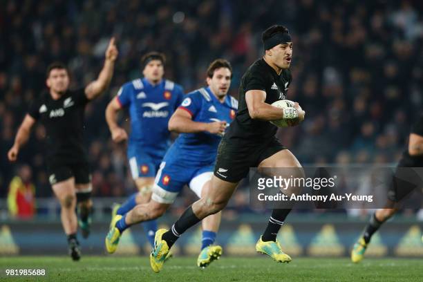 Rieko Ioane of the All Blacks makes a break to score a try during the International Test match between the New Zealand All Blacks and France at...