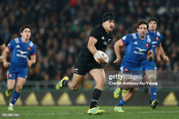 Rieko Ioane of the All Blacks makes a break to score a try during the International Test match between the New Zealand All Blacks and France at...