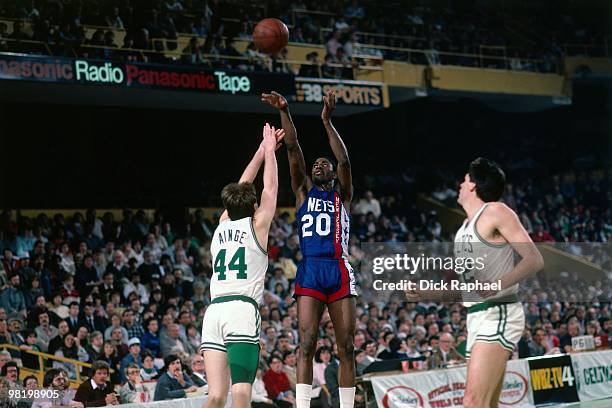 Micheal Ray Richardson of the New Jersey Nets shoots against Danny Ainge of the Boston Celtics during a game played in 1985 at the Boston Garden in...