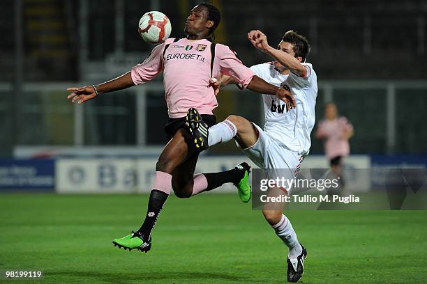 Jerry Uche Mbakogu of Palermo and Luca Ghiringhelli of Milan compete for the ball during the Juvenile Tim Cup Final, First Leg match between Palermo...