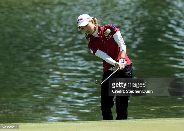 Momoko Ueda of Japan chips onto the sixth green during the first round of the Kraft Nabisco Championship at Mission Hills Country Club on April 1,...