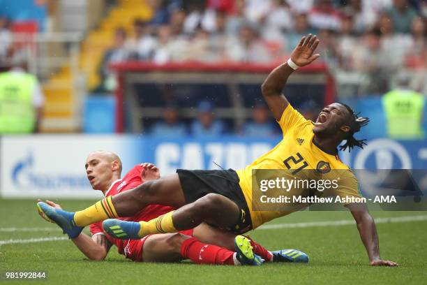 Yohan Ben Alouane of Tunisia challenges Michy Batshuayi of Belgium during the 2018 FIFA World Cup Russia group G match between Belgium and Tunisia at...