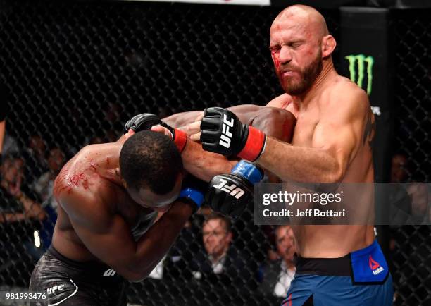 Leon Edwards of Jamaica elbows Donald Cerrone in their welterweight bout during the UFC Fight Night event at the Singapore Indoor Stadium on June 23,...