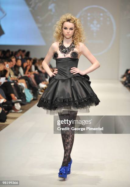 Model walks the runway wearing Coccolily fall 2010 collection at the Allstream Centre on April 1, 2010 in Toronto, Canada.