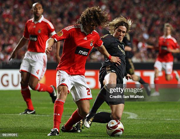 Fernando Torres of Liverpool battles for the ball with David Luiz of Benfica during the UEFA Europa League quarter final first leg match between...