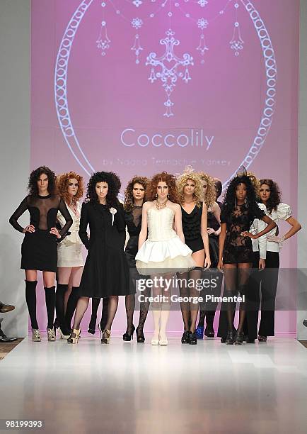 Models walk the runway wearing Coccolily fall 2010 collection at the Allstream Centre on April 1, 2010 in Toronto, Canada.