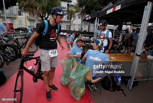 An athlete racks his bike ahead of Ironman Nice on June 23, 2018 in Nice, France.