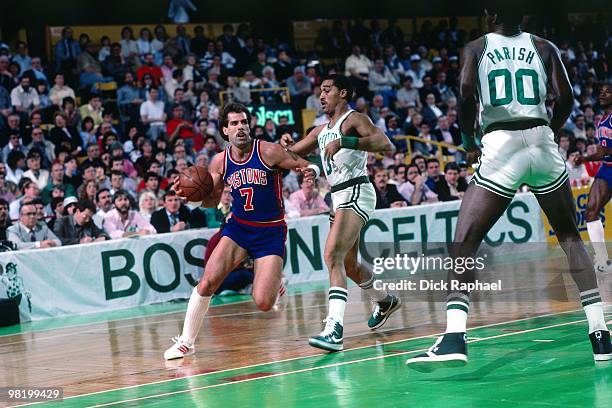 Kelly Tripucka of the Detroit Pistons drives against the Boston Celtics during a game played in 1985 at the Boston Garden in Boston, Massachusetts....