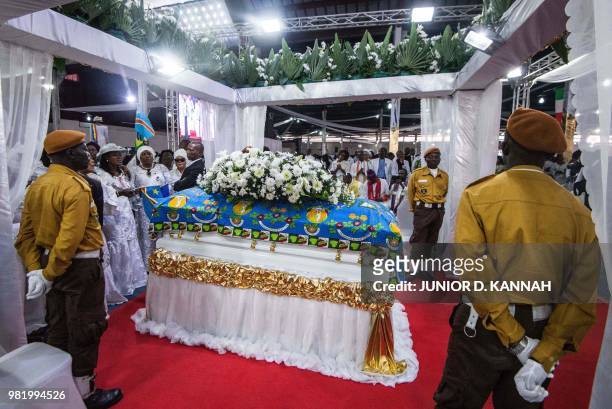 Protocol guards stand near the casket of controversial Congolese preacher Elisabeth Wosho Onyumbe known as "Maman Olangi" at her funeral in Kinshasa...