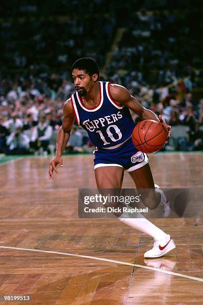 Norm Nixon of the Los Angeles Clippers drives against the Boston Celtics during a game played in 1985 at the Boston Garden in Boston, Massachusetts....