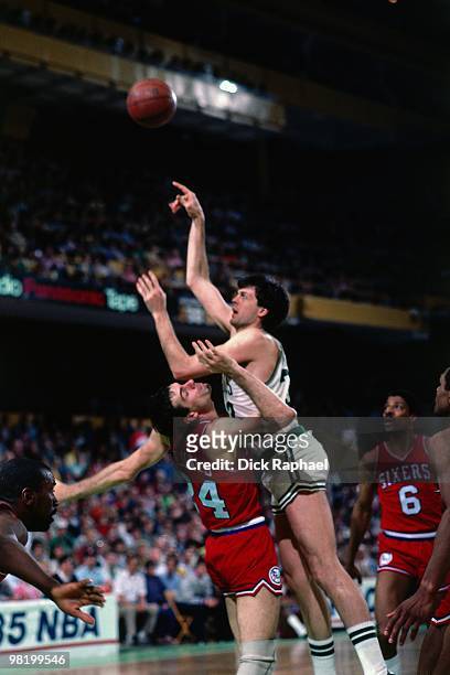 Kevin McHale of the Boston Celtics shoots against Bobby Jones of the Philadelphia 76ers during a game played in 1985 at the Boston Garden in Boston,...