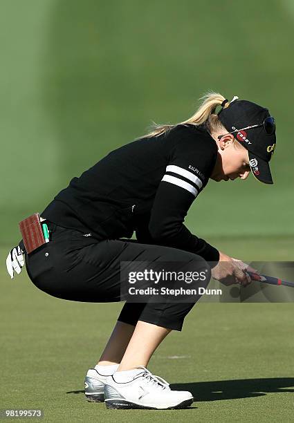 Morgan Pressel reacts as she just misses a putt on the 12th hole during the first round of the Kraft Nabisco Championship at Mission Hills Country...