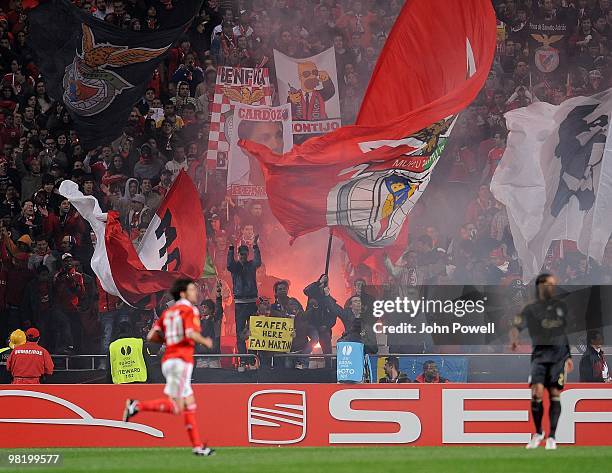 Benfica supporters wave banners during the UEFA Europa League quarter final first leg match between Benfica and Liverpool at the Estadio de Luz on...