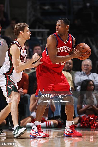 Willie Green of the Philadelphia 76ers handles the ball against Luke Ridnour of the Milwaukee Bucks during the game on March 24, 2010 at the Bradley...