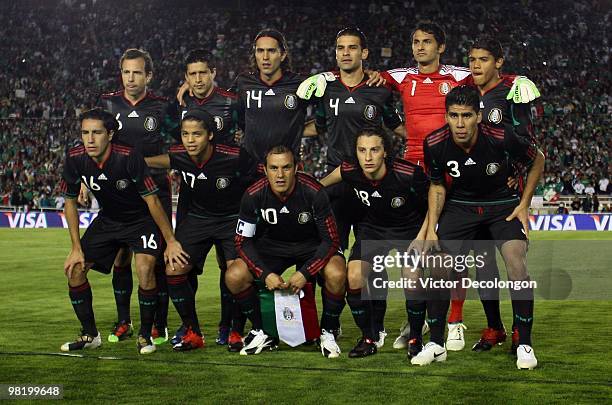 The starting line-up for Mexico pose for a team photo prior to their International Friendly match against New Zealand at the Rose Bowl on March 3,...