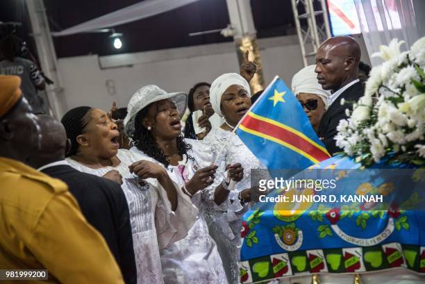 Followers of controversial Congolese preacher Elisabeth Wosho Onyumbe known as "Maman Olangi" arrive at her funeral in Kinshasa on June 23, 2018. -...