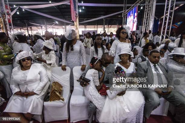 Family members of controversial Congolese preacher Elisabeth Wosho Onyumbe known as "Maman Olangi" attend her funeral in Kinshasa on June 23, 2018. -...