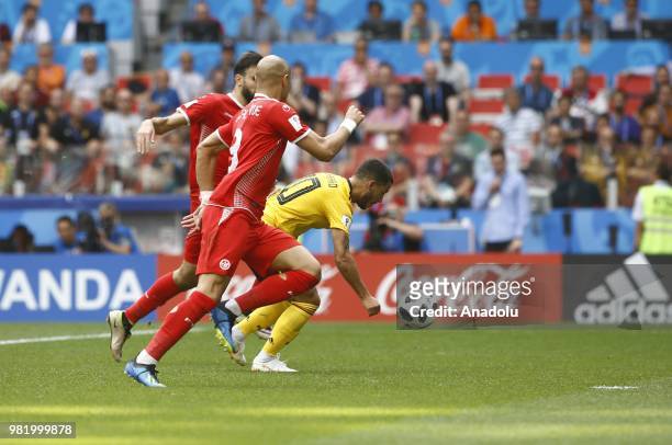 Eden Hazard of Belgium vies with Hamdi Nagguez and Yohan Benalouane of Tunisia during the 2018 FIFA World Cup Russia group G match between Belgium...
