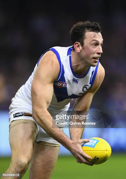 Todd Goldstein of the Kangaroos handballs during the round 14 AFL match between the Western Bulldogs and the North Melbourne Kangaroos at Etihad...