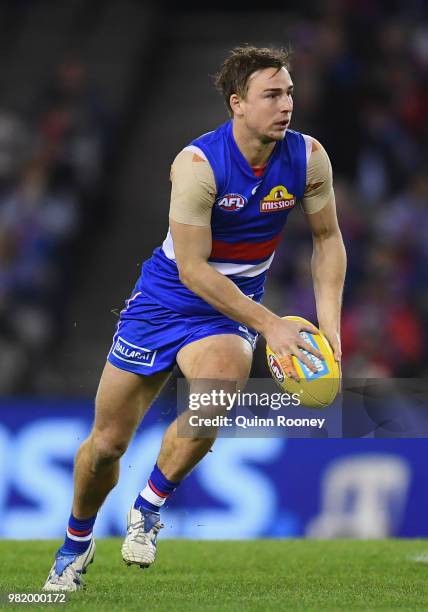 Mitch Honeychurch of the Bulldogs kicks during the round 14 AFL match between the Western Bulldogs and the North Melbourne Kangaroos at Etihad...