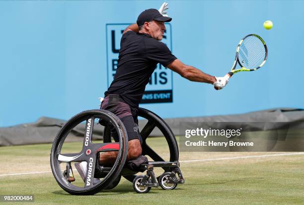 Stephane Houdet of France plays a backhand during the men's wheelchair match against Gordon Reid of Great Britain during Day 6 of the Fever-Tree...