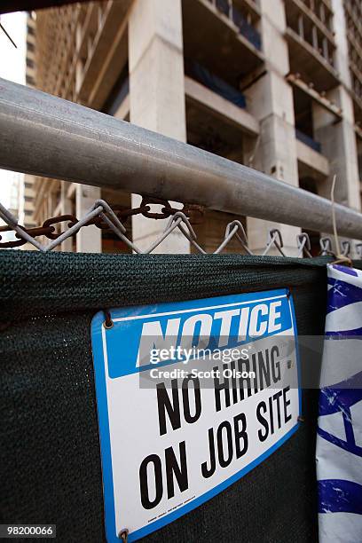 Sign hangs on the fence surrounding a vacant worksite for the proposed Waterview Tower hotel and condominium project April 1, 2010 in downtown...