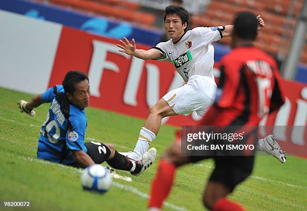 Kashima Antlers' Nozawa Takuya kicks the ball during their AFC champion's league at the Bung Karno stadium in Jakarta on March 30, 2010 as...