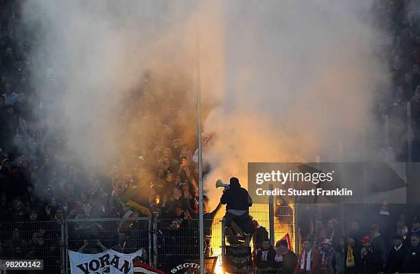 Fans of Liege light a flare during the UEFA Europa League quarter final, first leg match between Hamburger SV and Standard Liege at HSH Nordbank...