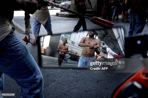 People self-flagellate as they march to Malacanang palace in Manila on March 30, 2010. Roman Catholic bishops in the Philippines recently criticised...