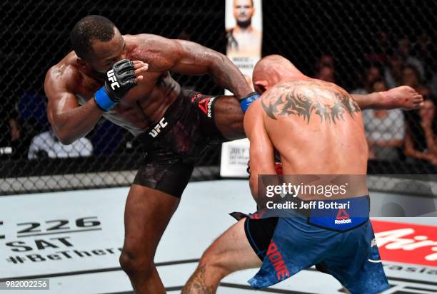 Leon Edwards of Jamaica kicks Donald Cerrone in their welterweight bout during the UFC Fight Night event at the Singapore Indoor Stadium on June 23,...