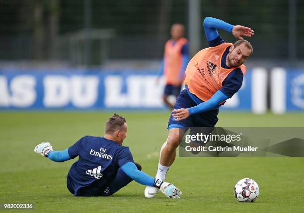 Goalkeeper Tom Mickel and Pierre-Michel Lasogga in action during the first training session of the new season at Volksparkstadion on June 23, 2018 in...